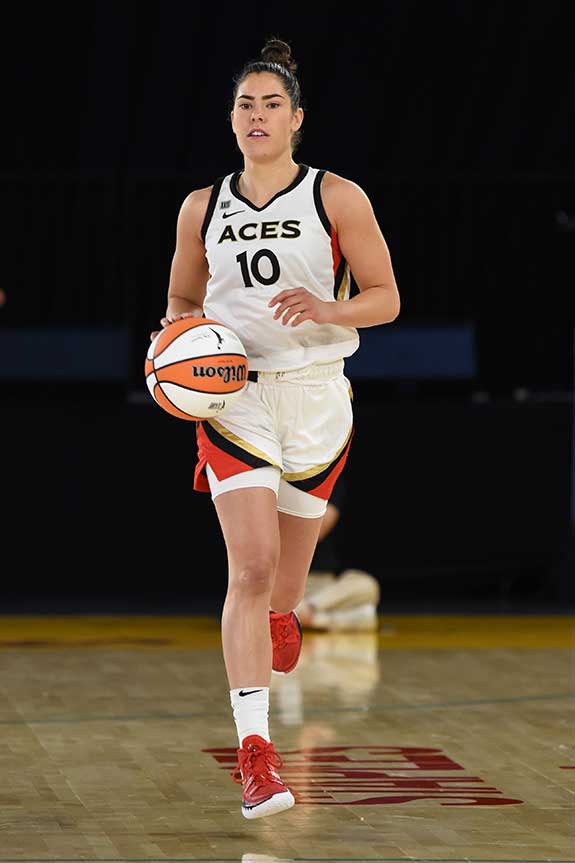 Photograph of Kelsey Plum dribbling by Juan Ocampo