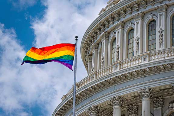 Capital building with rainbow flag