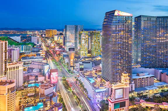 A magical view of the lights of the Las Vegas strip twinkle and glow in twilight of the setting sun.